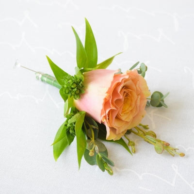 Rustic Rose Button Hole - Magnolia the Florist Our Rustic Rose buttonhole is the perfect finishing touch to add to your outfit for a special occasion, wedding, christening or funeral. Includes: 1 Large Headed Rose Touch of foliage accent Pin Please Note - Buttonholes are made for the day of the event ONLY and will only last around 6-8 hours from attaching to the outfit due to body heat. This item requires 1 day notice to order.