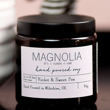 Smoked Fig, Honey & Amber Scented Candle - 96g - Magnolia the Florist Indulge in luxury with our exclusive smoked fig, honey, and amber-scented candle. Hand-poured into our signature screw-top jar, this candle will immerse your senses in sensual notes of smoky fig, sweet honey, and warm amber. Elevate any space with this exquisite and sophisticated fragrance. IEnjoy the aromatic benefits while enhancing any room with a touch of elegance, made with a professional blend of scented oil & emollient wax balm.