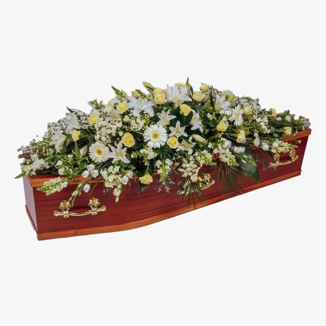 White & Cream Casket Spray - Magnolia the Florist This stunning casket spray is made from seasonal white and cream flowers and foliage. The image is an overall representation of the finished item and flower content may differ from the image shown. If you cannot find what you want on our site, please call our sales team, we're always happy to assist you. This item requires 2 days notice to order.