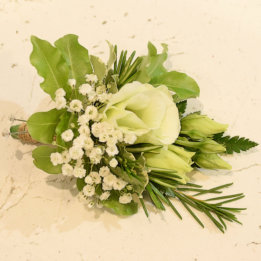 Boutonniere - Magnolia the Florist Beautiful floral accents to adorn a suit or lapel, featuring a stunning mix of textures and tones. Each boutonniere comes with an easy-pin attachment.