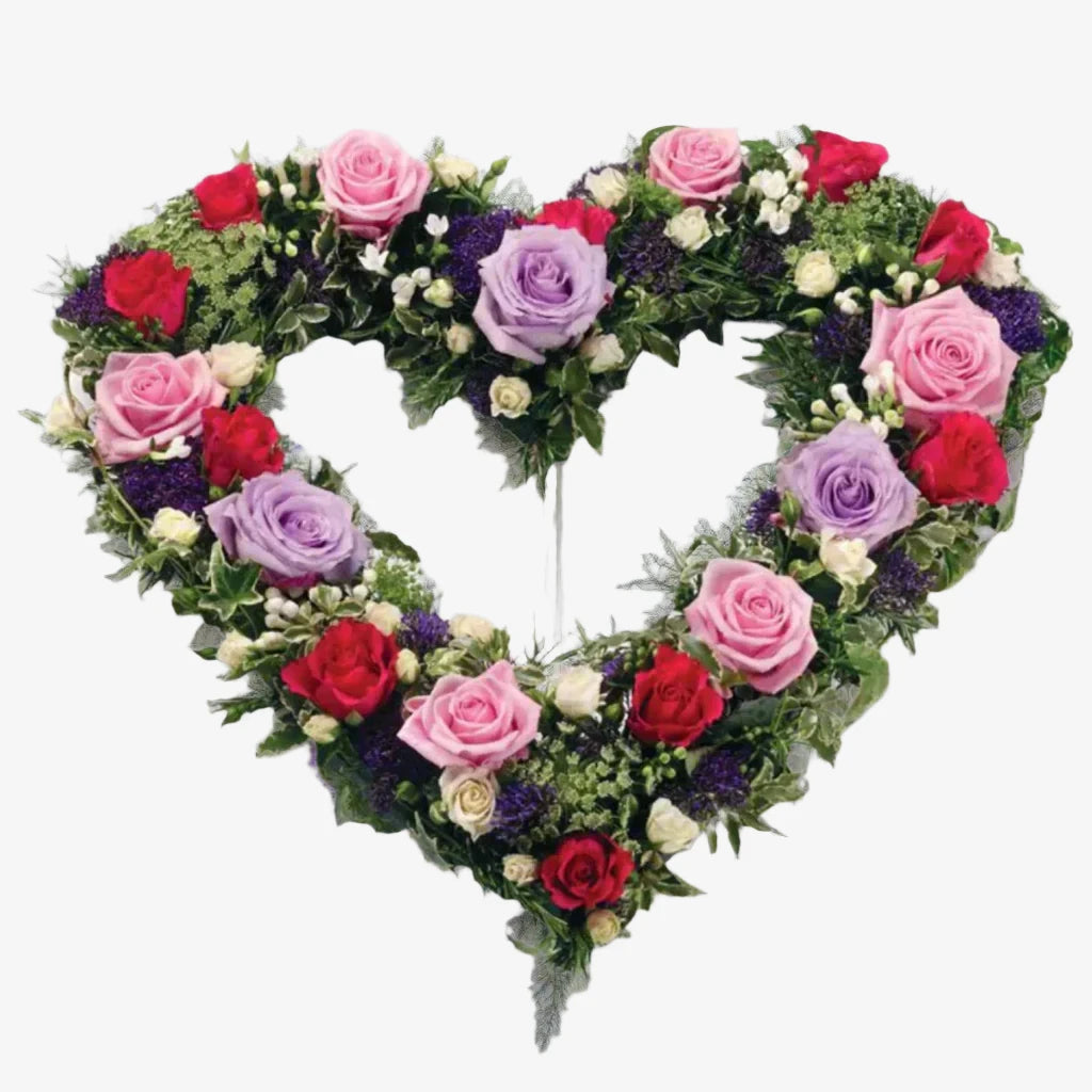 Garden Heart - Magnolia the Florist Large and small-headed Roses and Spray Roses in lilac, cream, cerise and pastel pink are nestled into a 17" open heart shape finished with sprigs of scented Rosemary. If you cannot find what you want on our site, please call our sales team, we're always happy to assist you This item requires 2 days notice to order.