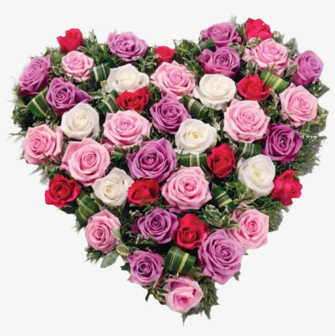 Rose Heart - Magnolia the Florist Large and small-headed Roses and Spray Roses in lilac, cream and pastel pink are nestled into a solid 15" heart shape finished with Dracaena leaves and sprigs of scented Rosemary. If you cannot find what you want on our site, please call our sales team, we're always happy to assist you This item requires 3 days notice to order.