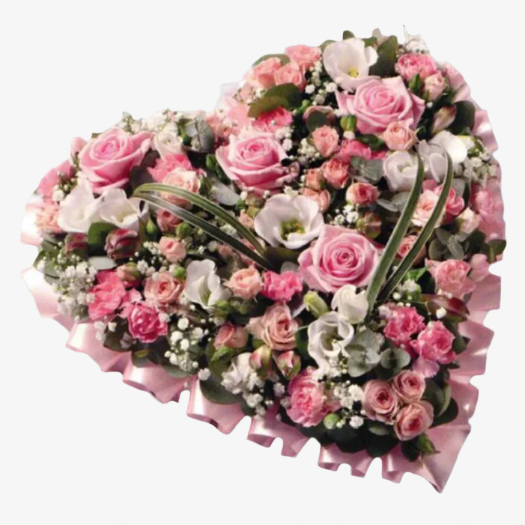 Pink & White Heart - Magnolia the Florist A 15" heart-shaped design in pink shades including large-headed Roses, Spray Roses, Lisianthus, Spray Carnations, Alstroemeria and Gypsophila. If you cannot find what you want on our site, please call our sales team, we're always happy to assist you This item requires 3 days notice to order.