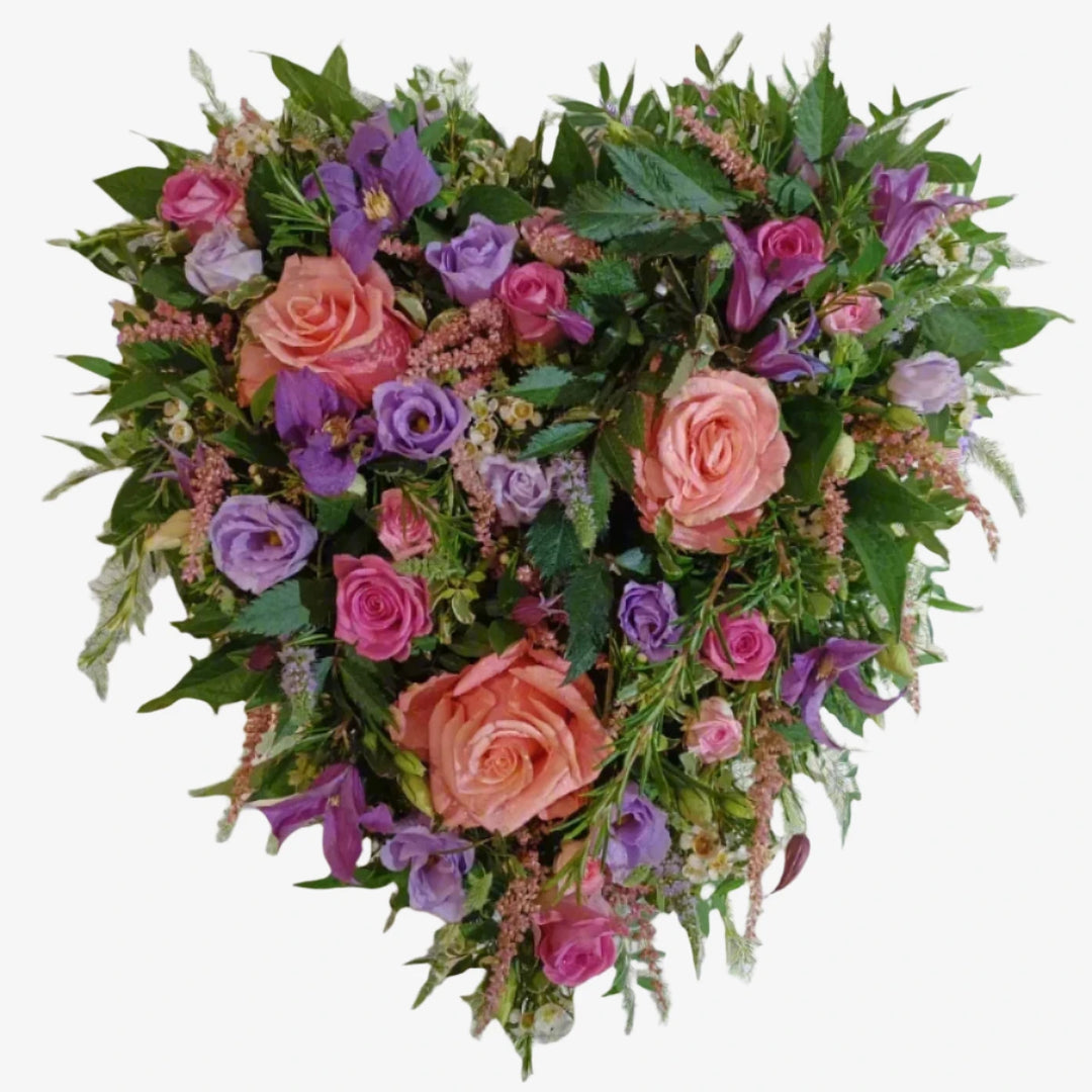 Cottage Garden Heart - Magnolia the Florist A 13" heart-shaped design with pink-toned large-headed roses, Pink spray roses, Lisianthus, rosemary and foliage.. If you cannot find what you want on our site, please call our sales team, we're always happy to assist you This item requires 3 days notice to order.