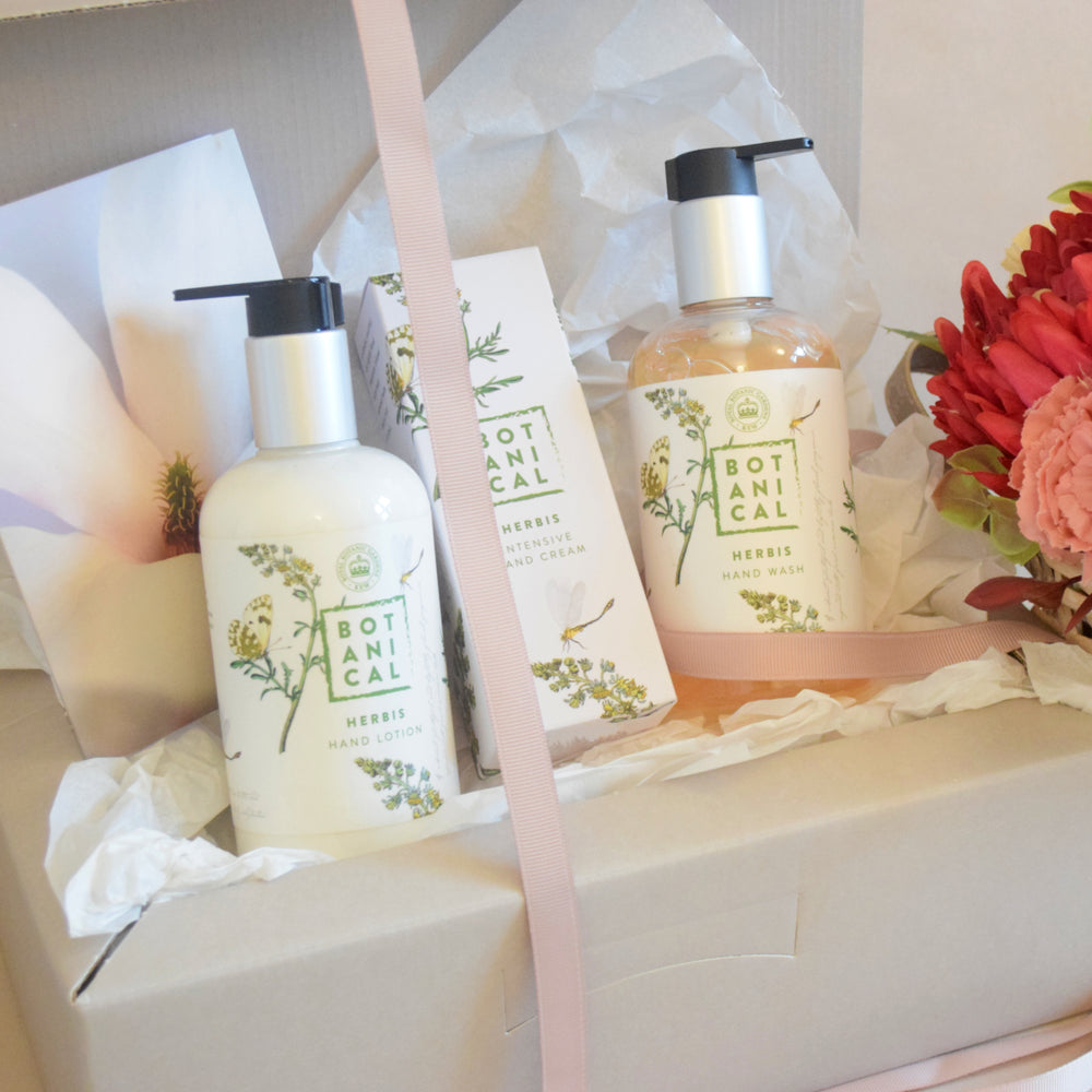 Herbis Botanical Hand Care Gift Box - Magnolia the Florist This luxurious gift box is a great way to pamper someone special with a sumptuous botanical hand care experience. The Flores Botanical Body Cream, Hand Wash and Intensive Hand Cream will keep their hands smooth and nourished. The products are presented in a beautiful gift box and bow. Treat yourself or someone special to this wonderful selection today. This item requires 1-day notice to order.