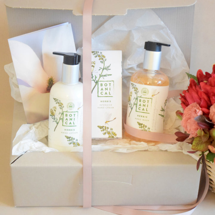 Herbis Botanical Hand Care Gift Box - Magnolia the Florist This luxurious gift box is a great way to pamper someone special with a sumptuous botanical hand care experience. The Flores Botanical Body Cream, Hand Wash and Intensive Hand Cream will keep their hands smooth and nourished. The products are presented in a beautiful gift box and bow. Treat yourself or someone special to this wonderful selection today. This item requires 1-day notice to order.