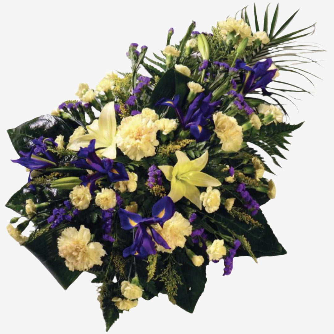 Yellow and Purple Single-Ended Spray - Magnolia the Florist This yellow and purple single-ended spray is created with a mixture of Carnations, Irises, Spray Carnations and luxury foliage. Single Ended Sprays have an approximate length of 55 cm. If you cannot find what you want on our site, please call our sales team, we're always happy to assist you This item requires 2 days notice to order.