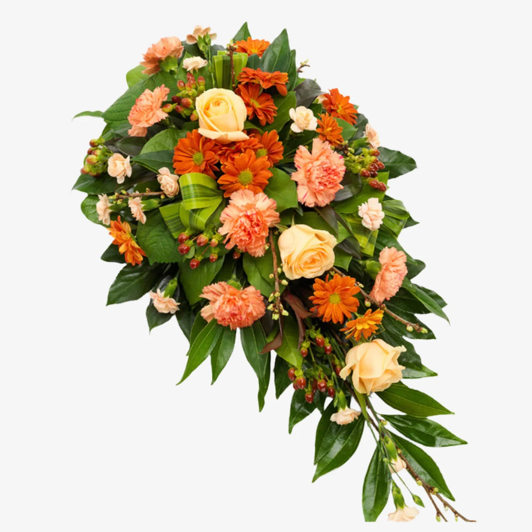 Orange Single-Ended Spray - Magnolia the Florist This single-ended funeral spray in orange tones features a beautiful mix of roses, carnations, and other seasonal flowers and foliage. With its elegant and vibrant design, it serves as a heartfelt tribute to your loved one. The perfect way to honour and celebrate their life. If you cannot find what you want on our site, please call our sales team, we're always happy to assist you This item requires 2 days notice to order.