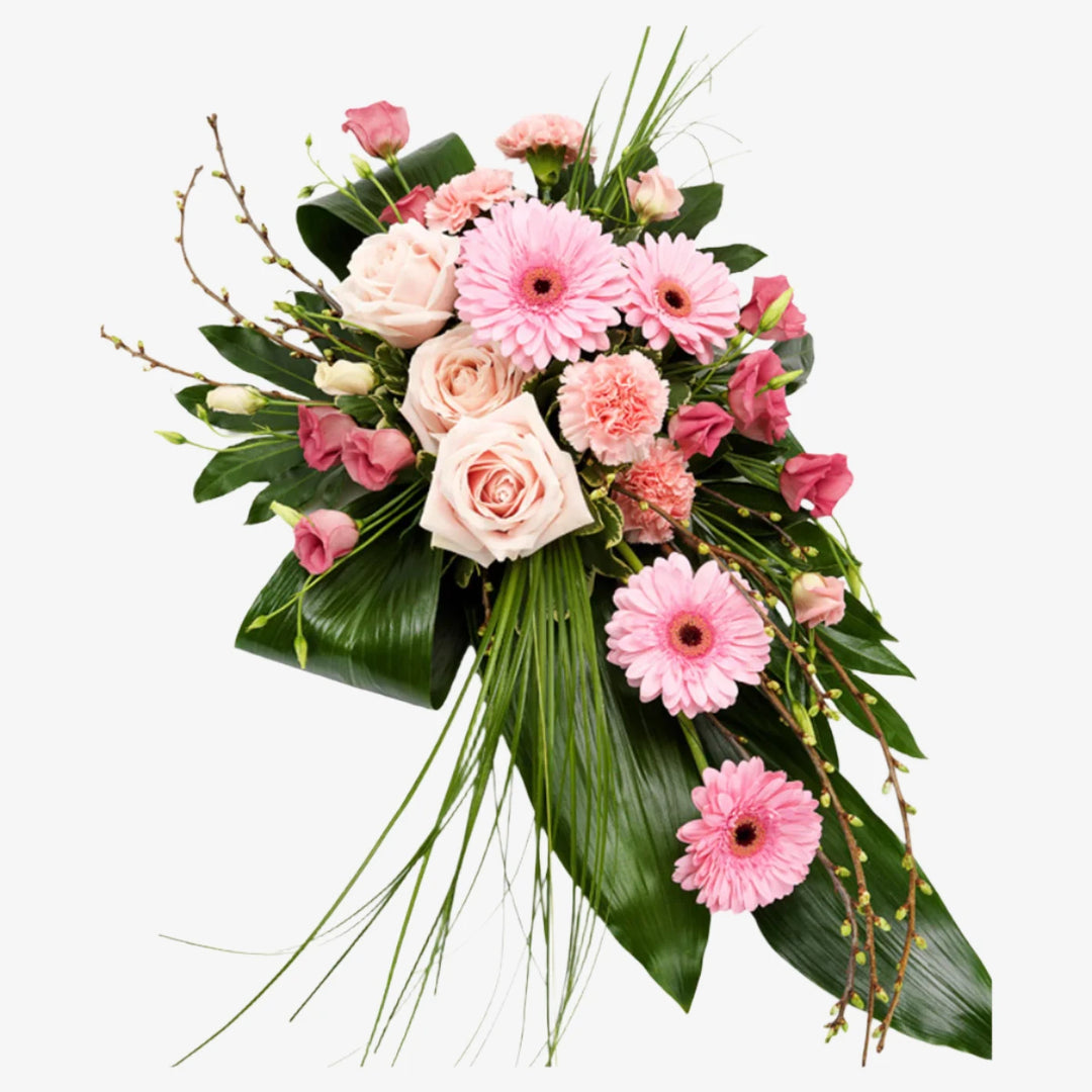 Pink Single-Ended Spray - Magnolia the Florist This beautiful single-ended funeral spray in pink tones is a thoughtful and elegant way to honour your loved one. Featuring roses, mini gerbera, and other seasonal mix flowers and foliage. If you cannot find what you want on our site, please call our sales team, we're always happy to assist you This item requires 2 days notice to order.