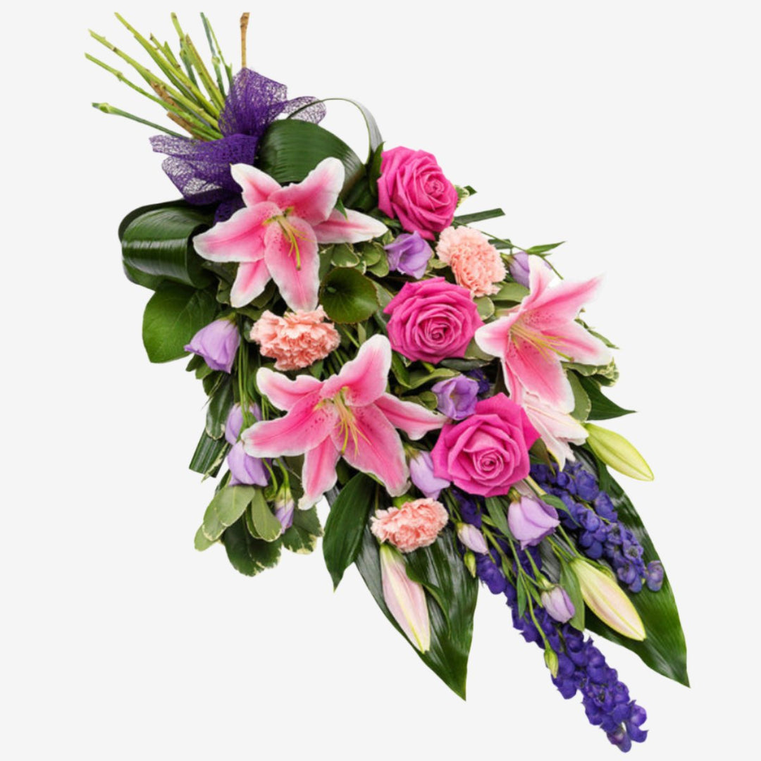 Purple & Pink Sheaf - Magnolia the Florist A gorgeous pink Rose and Lily hand-tied sheaf with lavender Lisianthus, purple Statice and pink Carnations set against Aspidistra and Galax leaves.Please note that the approximate length of hand-tied sheaves is 45cm If you cannot find what you want on our site, please call our sales team, we're always happy to assist you. This item requires 2 days notice to order.