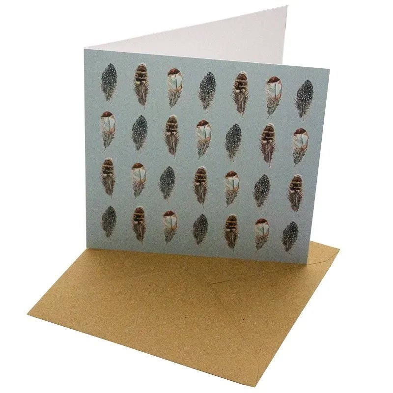 Blue Feathers Bird Greetings Card - Magnolia the Florist Gift your loved ones a beautiful Blue Feathers Greetings Card that will make any occasion special. This 148mm square card is made with a sustainable, 100% recycled unbleached 350gsm paper. The featured feather design with a blank interior for a personal message makes it a perfect choice for any special day.