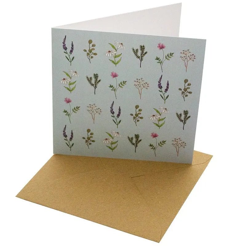 Blue Wild Flowers Greetings Card - Magnolia the Florist Gift your loved ones a beautiful Blue Wild Flowers Greetings Card that will make any occasion special. This 148mm square card is made with a sustainable, 100% recycled unbleached 350gsm paper. The featured feather design with a blank interior for a personal message makes it a perfect choice for any special day.