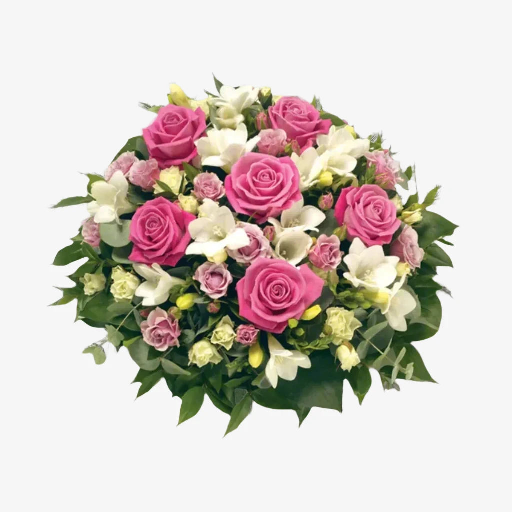 Rose & Freesia Posy - Magnolia the Florist This funeral posy features delicate pink roses and elegant white freesia, creating a beautiful and respectful tribute to a loved one. The combination of these flowers evokes emotions of grace and remembrance, making it a fitting offering for a funeral or memorial service. If you cannot find what you want on our site, please call our sales team, we're always happy to assist you This item requires 2 days notice to order.