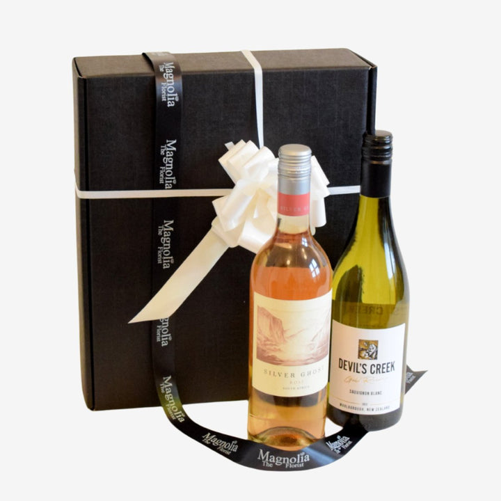 Wine Duo Gift Box - Magnolia the Florist Our fantastic gift box features two of our finest 75cl bottles of wine and is lovingly wrapped in a presentation box.Please note that this brand may be substituted for something of similar quality. We will not sell or deliver alcohol to anyone who is or appears to be, under the age of 18. By placing an order you confirm that you are at least 18 years old and we reserve the right not to deliver if we are unsure of this.