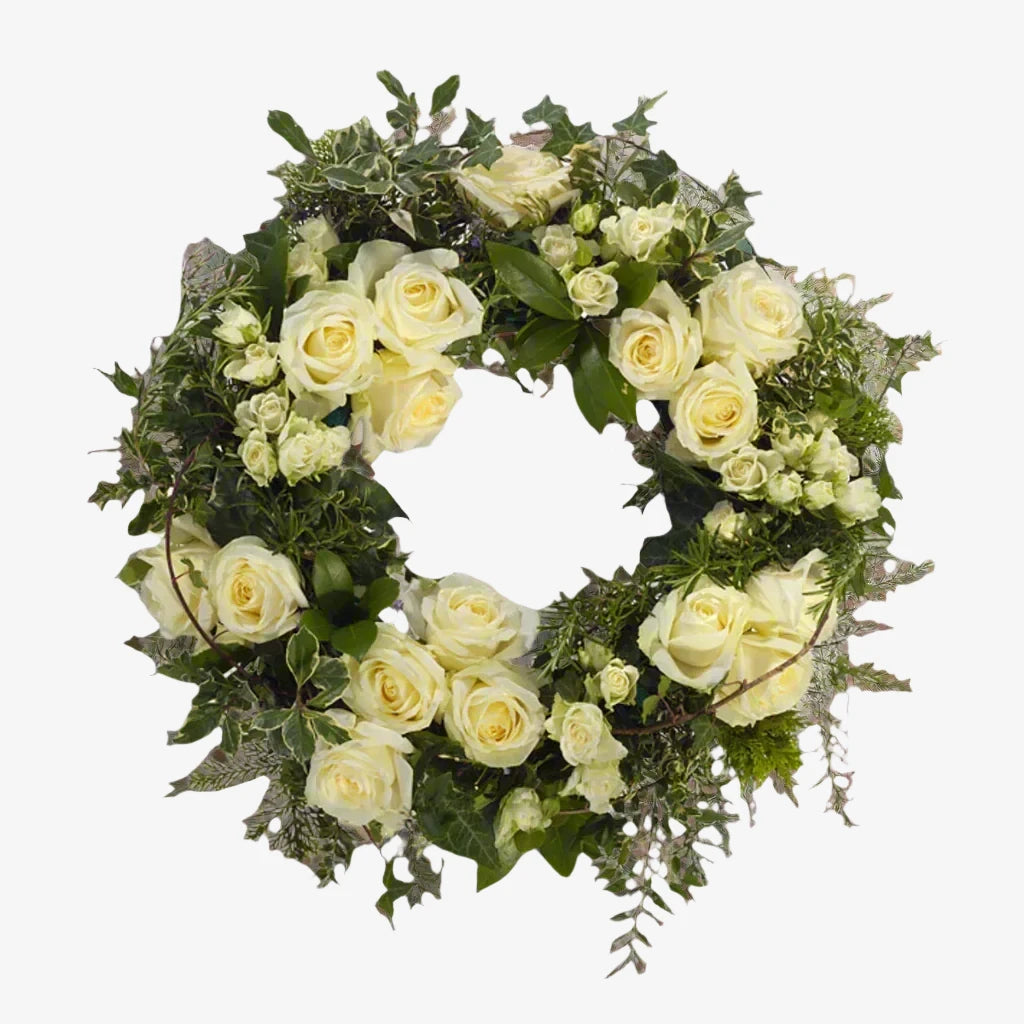 Rose Wreath - Magnolia the Florist Large-headed roses are used to create this special tribute, with spray roses and foliage to compliment the beautiful roses. This design is available in other colour options, please select which option you would like. If you cannot find what you want on our site, please call our sales team, we're always happy to assist you This item requires 2 days notice to order.